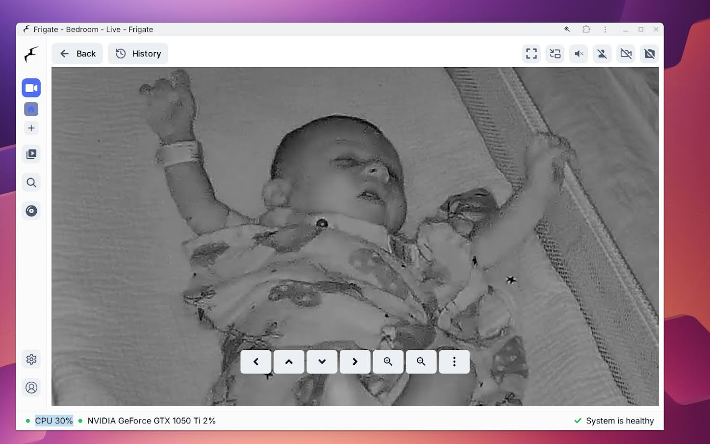 Security camera view of Ezra in bedroom